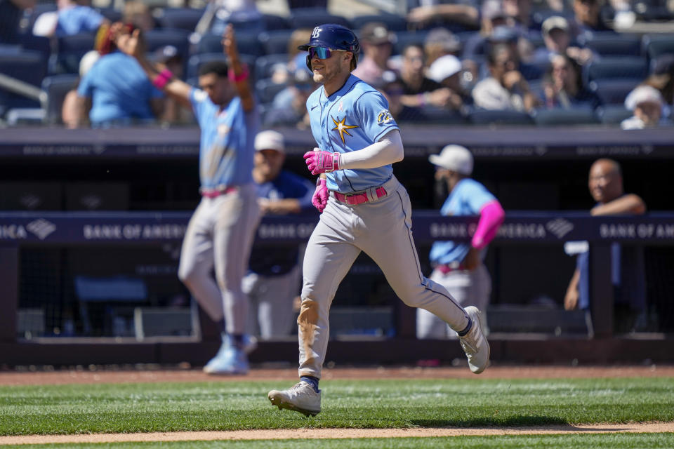 Tampa Bay Rays' Taylor Walls runs the bases after hitting a grand slam off New York Yankees relief pitcher Albert Abreu (84) in the fifth inning of a baseball game, Sunday, May 14, 2023, in New York. (AP Photo/John Minchillo)