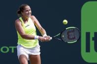 Mar 26, 2017; Miami, FL, USA; Shelby Rogers of the United States hits a backhand against Angelique Kerber of Germany (not pictured) on day six of the 2017 Miami Open at Crandon Park Tennis Center. Kerber won 6-4, 7-5. Mandatory Credit: Geoff Burke-USA TODAY Sports