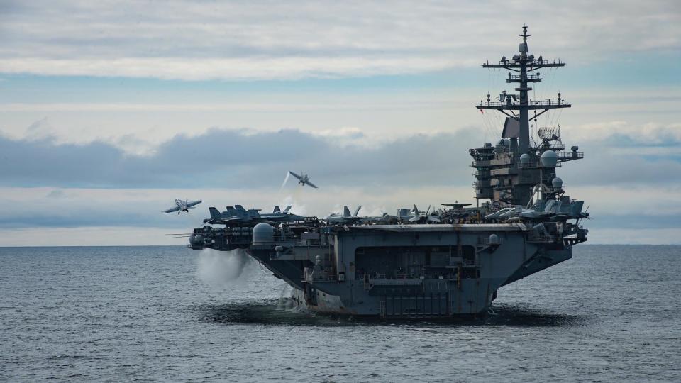 F/A-18 fighter jets take off from USS Theodore Roosevelt aircraft carrer