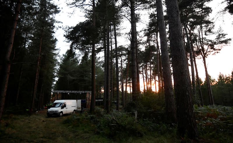 A van and sound system is seen in Thetford Forest after police shut down a suspected illegal rave, in Norfolk