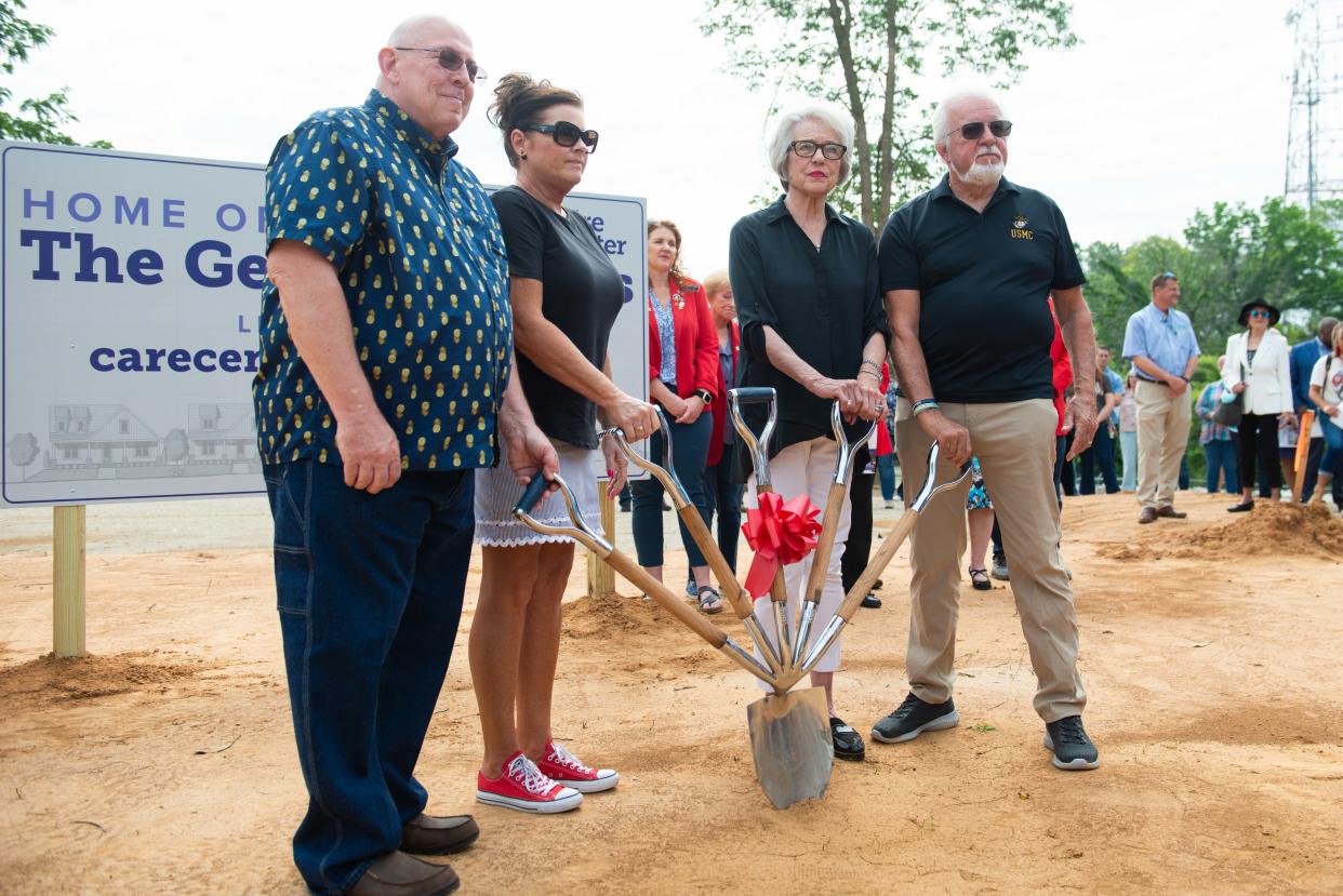 From left to right: Nathan Young, Susan Young, Elizabeth Taylor, Gary Deaton pose for a photo during the Genesis Homes project groundbreaking in Jackson, Tenn. on Wednesday, May 24, 2023.