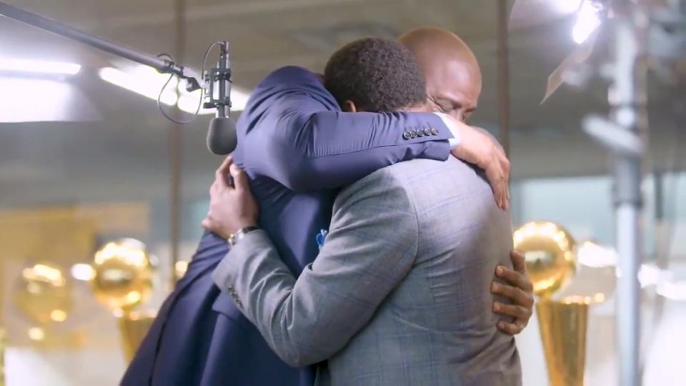 Magic Johnson and Isiah Thomas hug it out. (NBA TV)