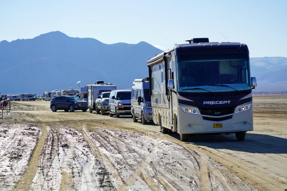 A line of RVs, campers and other vehicles drive out of Burning Man on Labor Day, several hours before the exit gates formally opened for departures.