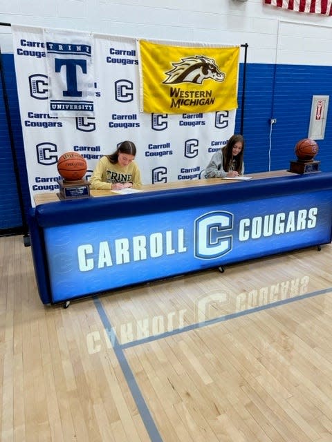 Carroll's Madison Wagner signs to Trine University for basketball and Alli Harness signs to Western Michigan during national signing day, Wednesday, Nov. 8, 2023, at Carroll High School in Flora, Ind.
