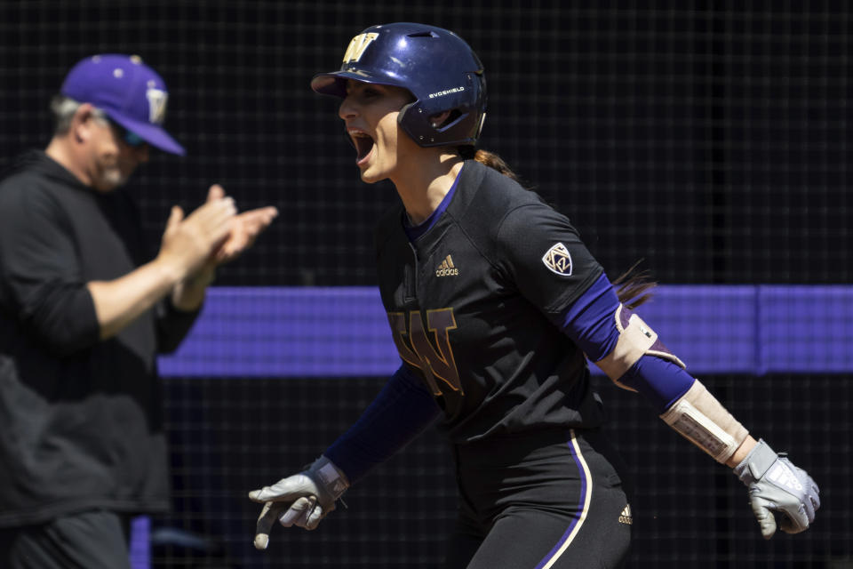 FILE - Washington's Baylee Klingler celebrates after hitting a home run during an NCAA softball game against Texas on May 21, 2022, in Seattle.(AP Photo/Stephen Brashear, File)