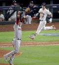 Boston Red Sox first baseman Steve Pearce celebrates after Houston Astros' Alex Bregman made the final out in Game 4 of a baseball American League Championship Series on Wednesday, Oct. 17, 2018, in Houston. (AP Photo/Lynne Sladky)