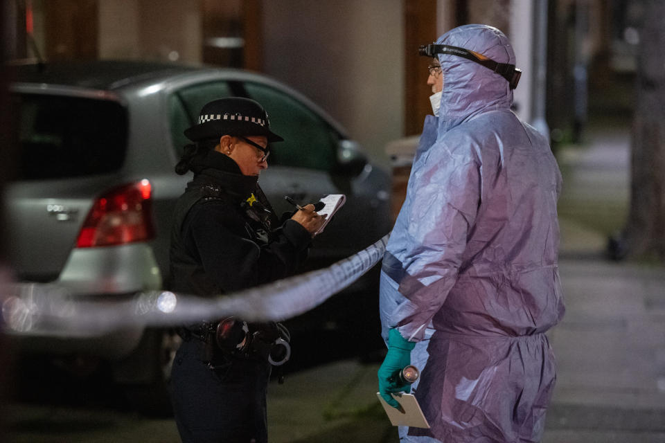 Police and forensics officers at the scene in Seven Kings, Ilford after a multiple stabbing.