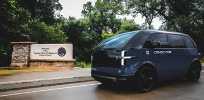 (Pawnee Nation Reservation, September 20, 2023 -- A Canoo clean technology multi-passenger vehicle is parked at the entrance of the recently constructed Pawnee Nation War Mother’s Bridge. Photo by Geneva HorseChief, Pawnee Nation Creative Media.)