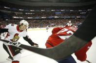 Feb 26, 2019; Washington, DC, USA; Washington Capitals center Travis Boyd (72) skates with the puck as Ottawa Senators defenseman Thomas Chabot (72) chases in the first period at Capital One Arena. The Capitals won 7-2. Mandatory Credit: Geoff Burke-USA TODAY Sports