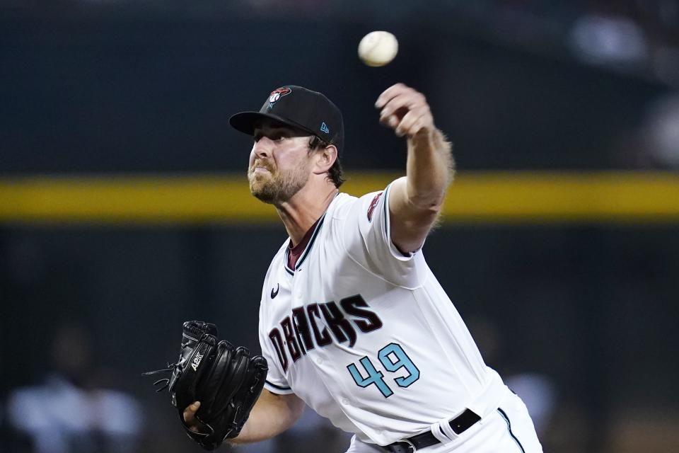Arizona Diamondbacks starting pitcher Tyler Gilbert throws a pitch to a San Francisco Giants batter during the first inning of a baseball game Tuesday, July 5, 2022, in Phoenix. (AP Photo/Ross D. Franklin)