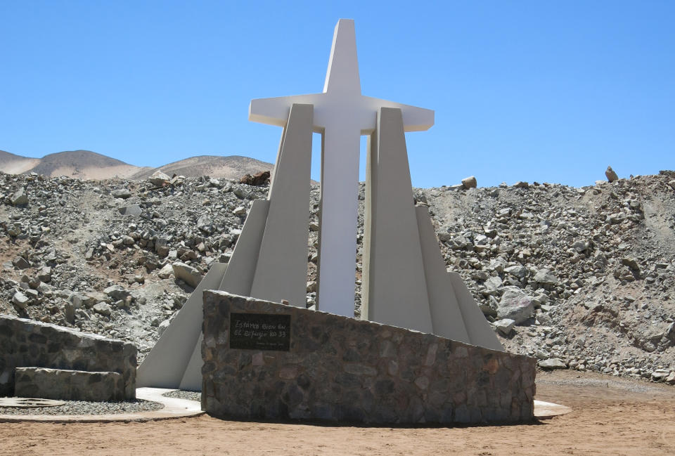 In this Feb. 11, 2014 photo, a monument stands in honor of miners who were rescued from the collapsed San Jose mine near Copiapo, Chile. The film "The 33" is in the works in Chile, which dramatizes the cave-in that trapped 33 miners deep below Chile's Atacama desert for 69 days in 2010. Actors Juliette Binoche and Antonio Banderas are starring in the film based on the televised rescue that mesmerized millions of people around the globe. The movie is being shot in English and is expected to be released next year. (AP Photo/Eva Vergara)