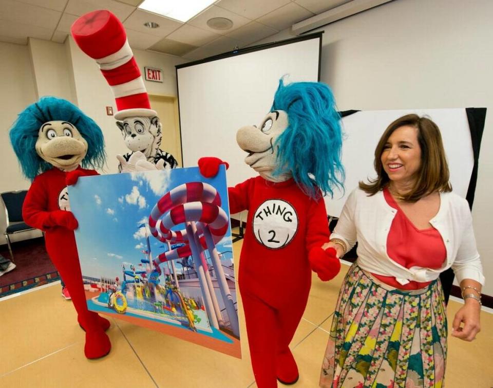 Carnival Cruise Line President Christine Duffy, right, leads Dr. Seuss characters holding a rendering of a new Dr. Seuss-themed water park at a news conference Thursday, April 20, 2017, at the Cruise3Sixty travel agent convention in Fort Lauderdale.