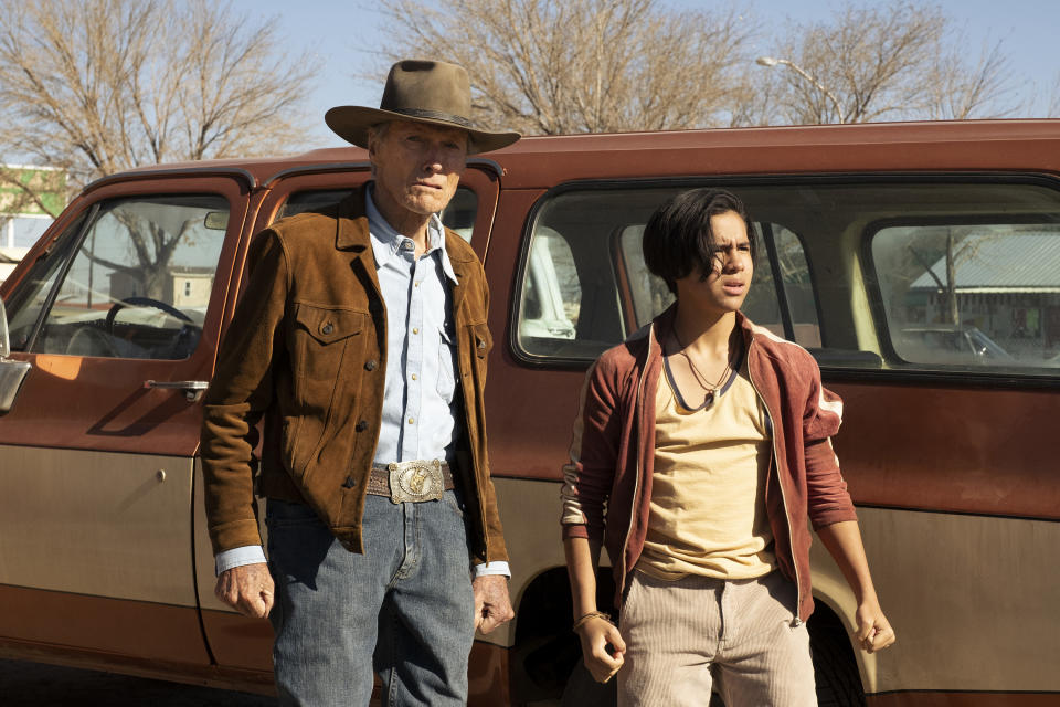 This image released by Warner Bros. Pictures shows Clint Eastwood, left, and Eduardo Minett in a scene from "Cry Macho." (Claire Folger/Warner Bros. Pictures via AP)