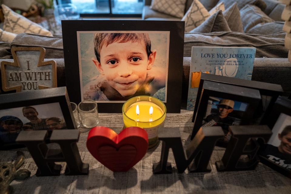 A memorial with photographs of Christian Petillo is displayed inside the Petillo family's home in Gilbert. Christian,15, was accidentally shot by a friend who had gotten hold of an unsecured firearm in his home in 2021. “This will probably be something we do (pushing for gun safety laws) for the rest of our lives,” his father, Bruce Petillo, says. “He (Christian) will forever be 15.”