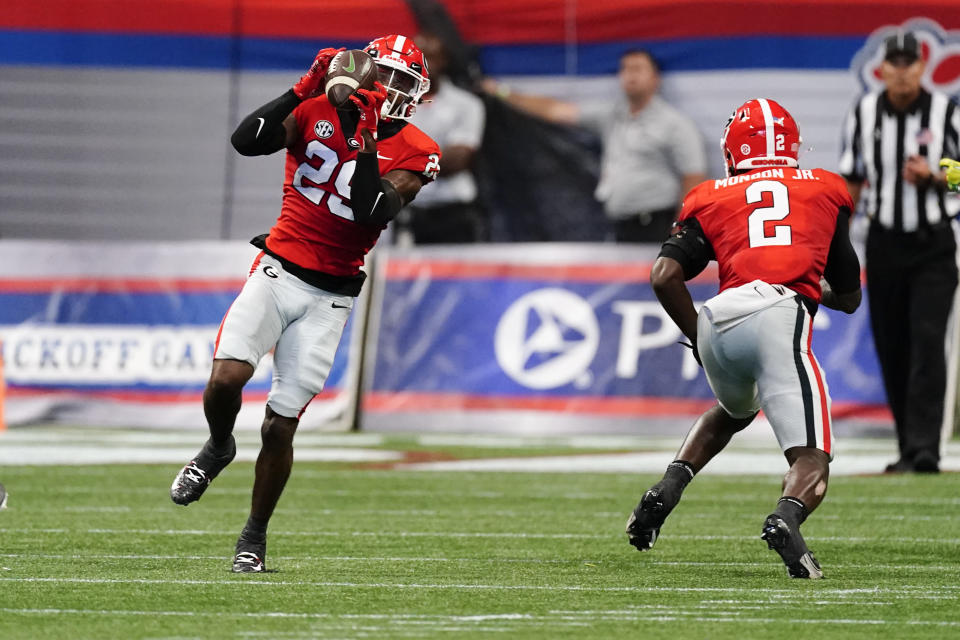 Georgia defensive back Christopher Smith (29) intercepts a pass from Oregon quarterback Bo Nix in the first half of an NCAA college football game Saturday, Sept. 3, 2022, in Atlanta. (AP Photo/John Bazemore)
