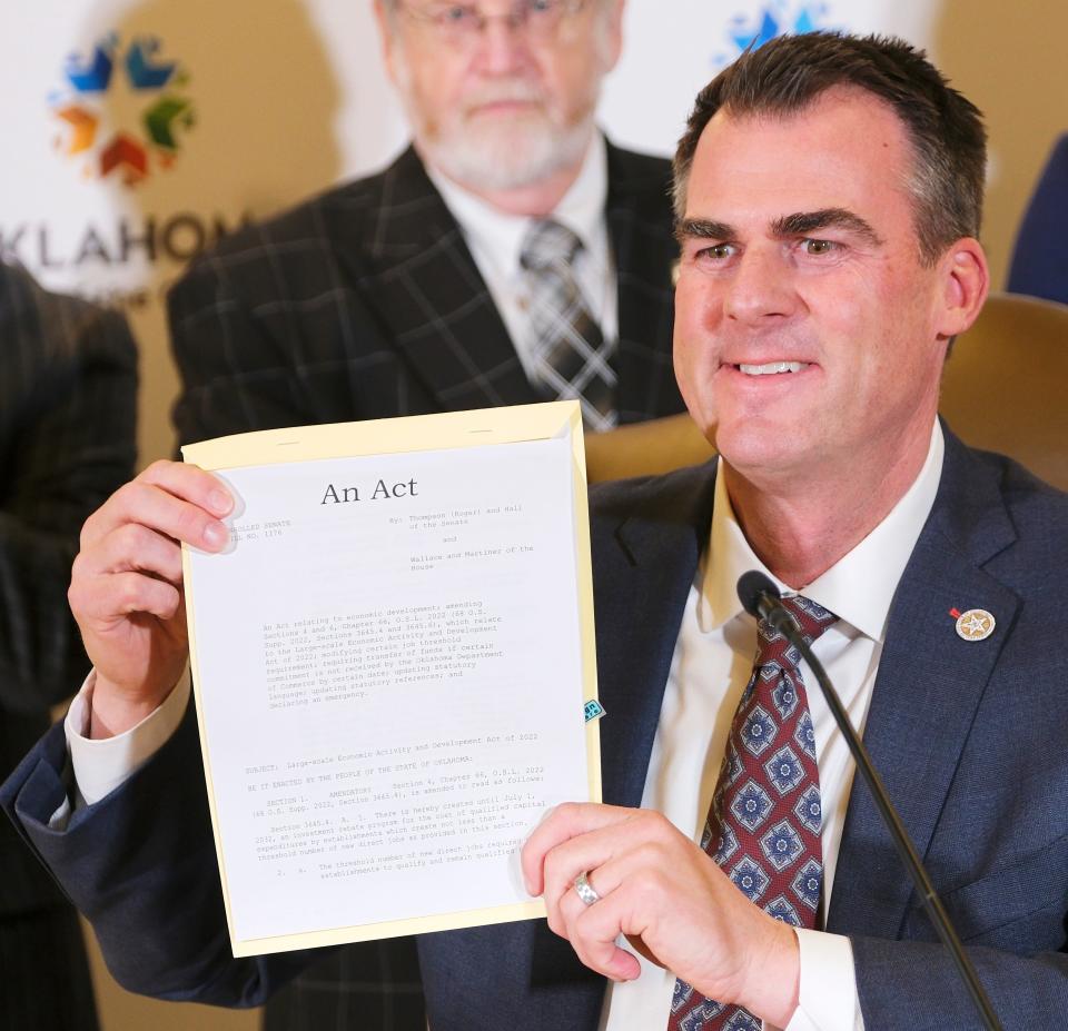 Oklahoma Gov. Kevin Stitt signs the LEAD Act on Thursday in the Blue Room at the Capitol.