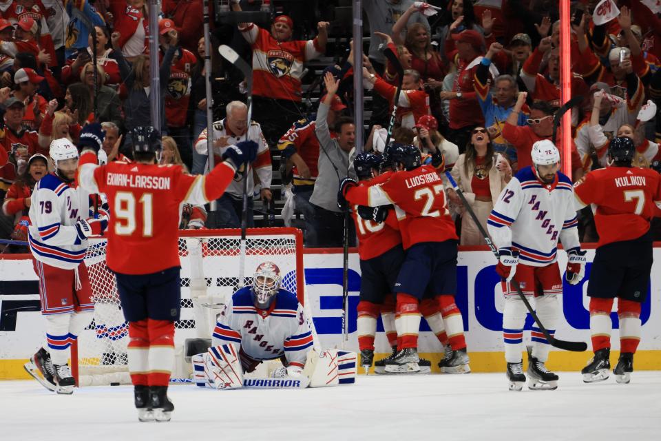 SUNRISE, FLORIDA - JUNE 01: Vladimir Tarasenko #10 of the Florida Panthers celebrates after his goal against the New York Rangers with Eetu Luostarinen #27 during the third period in Game Six of the Eastern Conference Final of the 2024 Stanley Cup Playoffs at Amerant Bank Arena on June 01, 2024 in Sunrise, Florida.