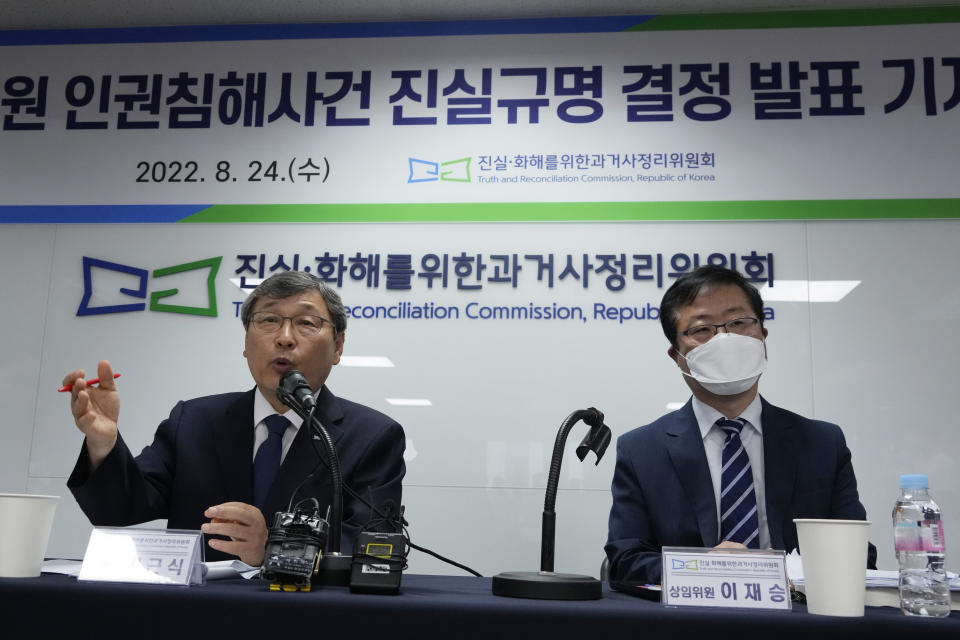 Truth and Reconciliation Commission's chairperson Jung Geun-sik, left, speaks during a press conference at its office in Seoul, South Korea, Wednesday, Aug. 24, 2022. The commission has found the country's past military governments responsible for atrocities committed at Brothers Home, a state-funded vagrants' facility where thousands were enslaved and abused from the 1960s to 1980s. (AP Photo/Ahn Young-joon)