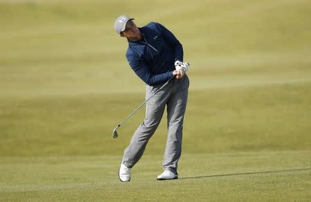 Paul Dunne of Ireland watches his second shot on the 16th hole during the third round of the British Open golf championship on the Old Course in St. Andrews, Scotland, July 19, 2015. REUTERS/Lee Smith