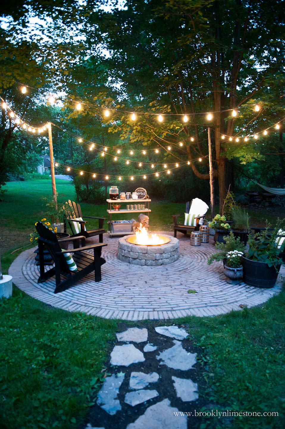 <p>There's nothing better than sitting around a fire pit with friends and family, drinking, reminiscing, and making s'mores. Only string lights could make this moment even cozier.</p><p><strong>See more at <a href="http://www.brooklynlimestone.com/2016/08/country-cottage-diy-circular-firepit.html" rel="nofollow noopener" target="_blank" data-ylk="slk:Brooklyn Limestone;elm:context_link;itc:0;sec:content-canvas" class="link ">Brooklyn Limestone</a>.</strong></p><p><a class="link " href="https://www.amazon.com/dp/B07T3JX7VM/ref=sspa_dk_detail_3?tag=syn-yahoo-20&ascsubtag=%5Bartid%7C10050.g.3404%5Bsrc%7Cyahoo-us" rel="nofollow noopener" target="_blank" data-ylk="slk:Shop String Lights;elm:context_link;itc:0;sec:content-canvas">Shop String Lights</a></p>