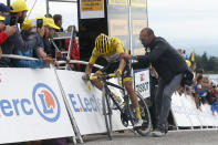 France's Julian Alaphilippe wearing the overall leader's yellow jersey reacts as he crosses the finish line of the sixth stage of the Tour de France cycling race over 160 kilometers (100 miles) with start in Mulhouse and finish in La Planche des Belles Filles, France, Thursday, July 11, 2019. (AP Photo/Thibault Camus)