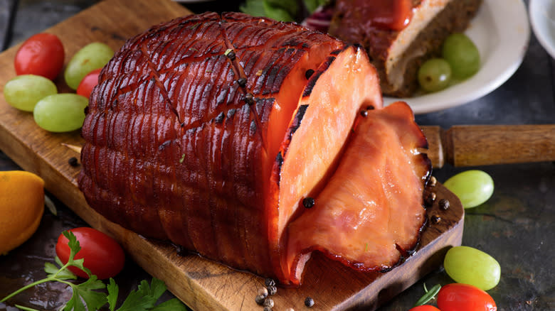 baked ham on cutting board