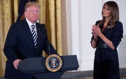 Donald Trump and Melania, his third wife, at an event in the White House - Credit: AFP PHOTO / SAUL LOEB