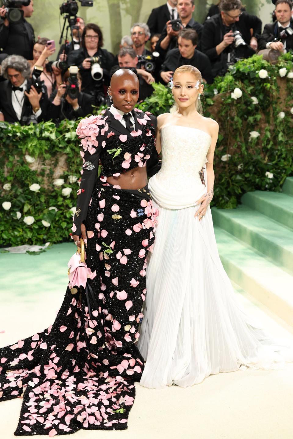 Cynthia Erivo in Thom Browne and Ariana Grande in Loewe  (Getty Images)