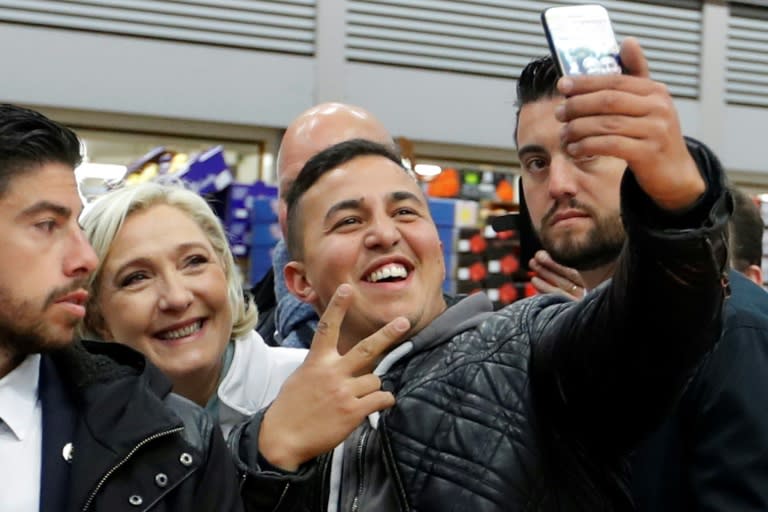 Some posed for selfies as Le Pen visited Rungis