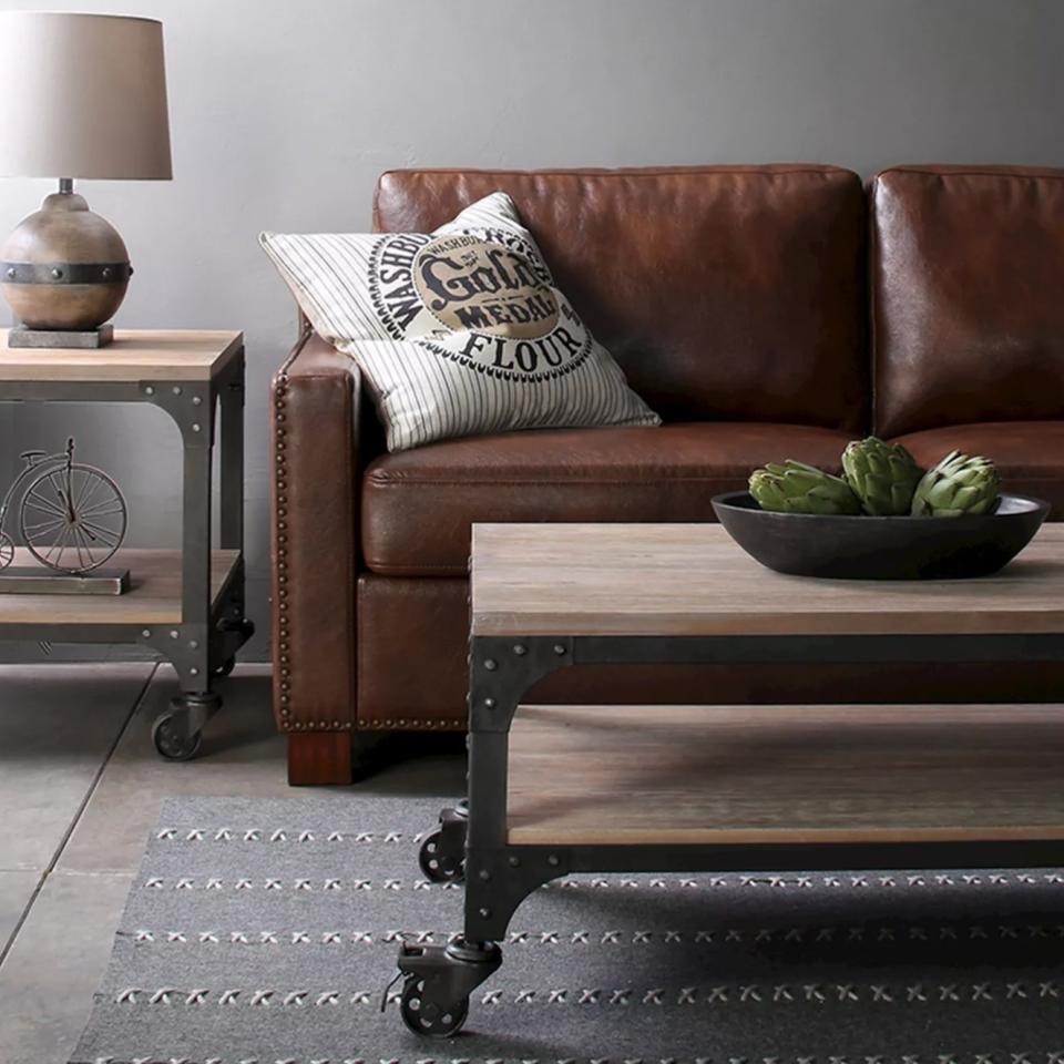 The wood coffee table in weathered gray