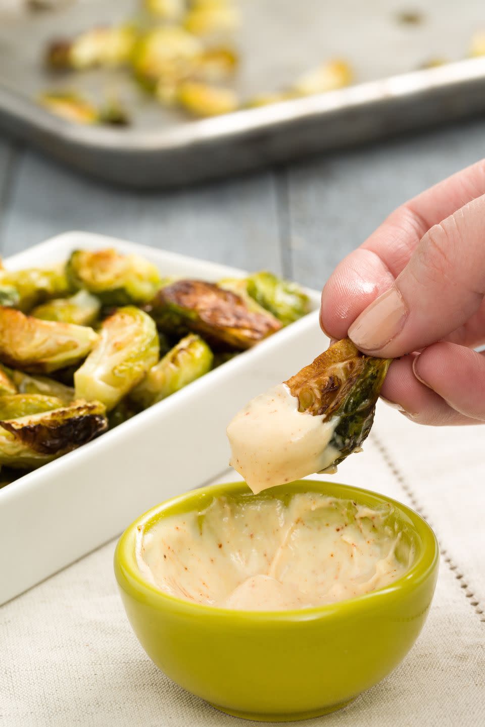 <p>If you're making brussels sprouts as a dinner side dish, just make extra for a dip-able app. Two-in-one FTW!</p><p>Get the recipe from <a href="https://www.redbookmag.com/holiday-recipes/thanksgiving/recipes/a44806/crispy-brussels-sprouts-with-spicy-aioli-recipe/" rel="nofollow noopener" target="_blank" data-ylk="slk:Delish;elm:context_link;itc:0;sec:content-canvas" class="link ">Delish</a>.</p>