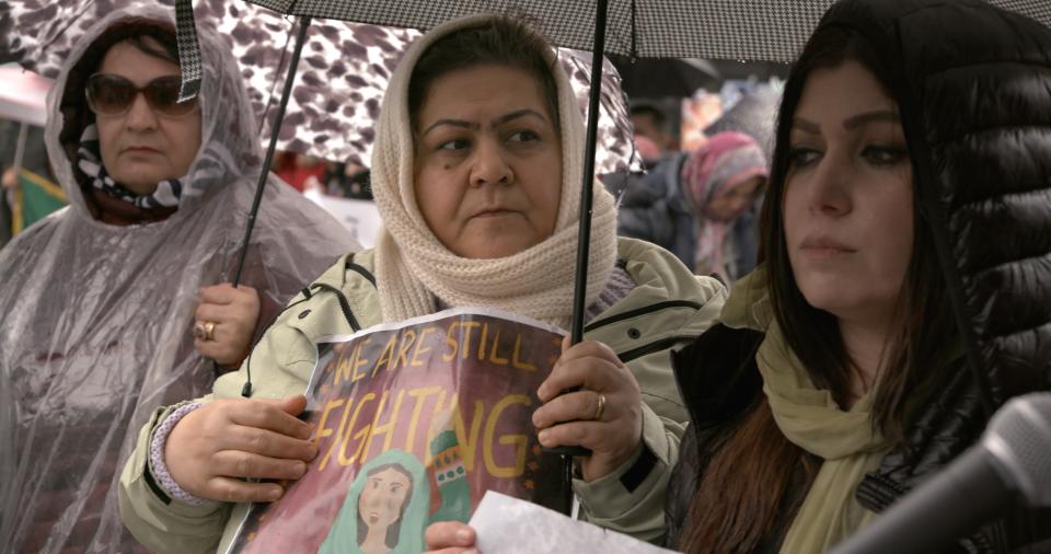 Homaira Ayubi at Toronto protest of school closures in An Unfinished Journey