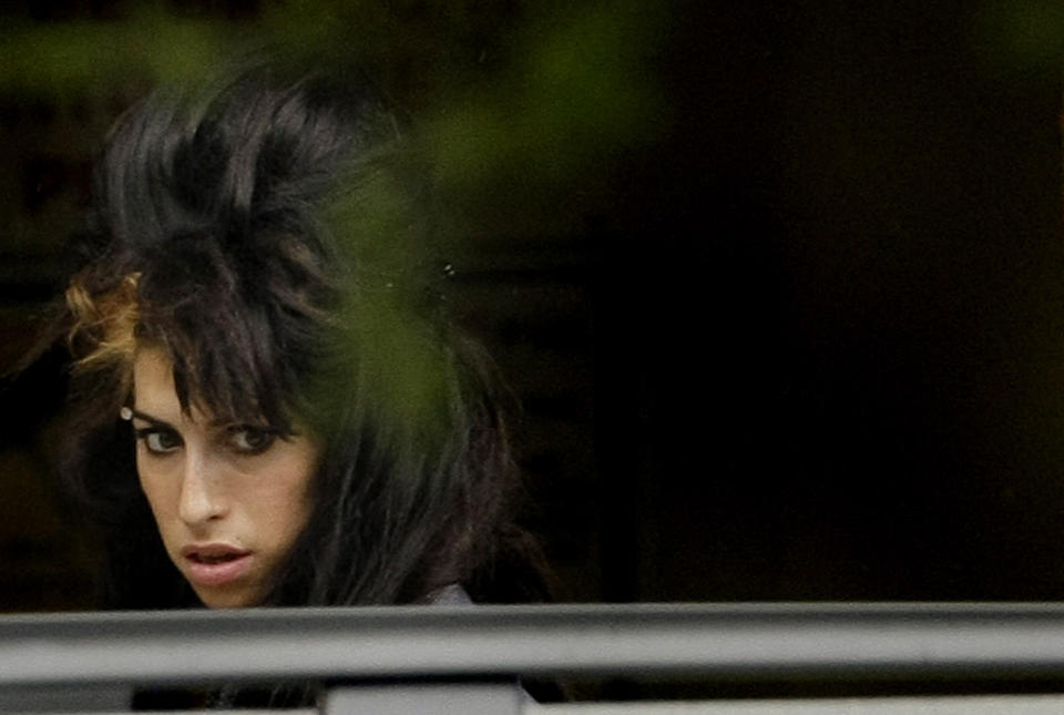 British singer Amy Winehouse arrives at London's Snaresbrook crown court on June 2, 2008. Amy Winehouse's husband Blake Fielder-Civil faces charges of assault and conspiracy to pervert the course of justice. AFP PHOTO/Shaun Curry (Photo by SHAUN CURRY / AFP) (Photo by SHAUN CURRY/AFP via Getty Images)