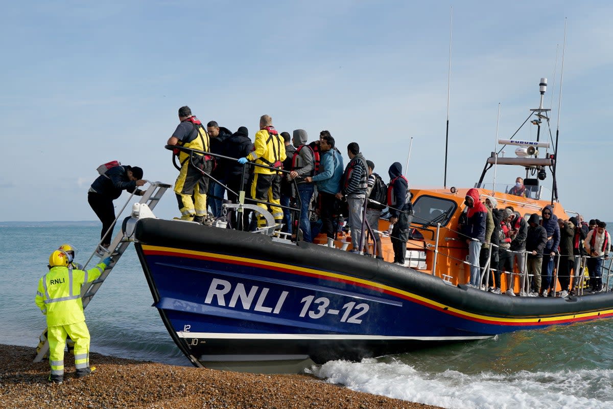 A group of people thought to be migrants arrive in Dungeness, Kent, after being rescued in the Channel by the RNLI (Gareth Fuller/PA Wire) (PA Wire)