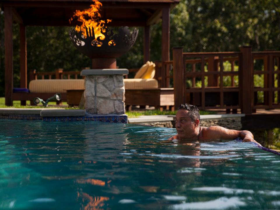 Ivan enjoying his infinity pool, which is flanked by fireballs on both ends.