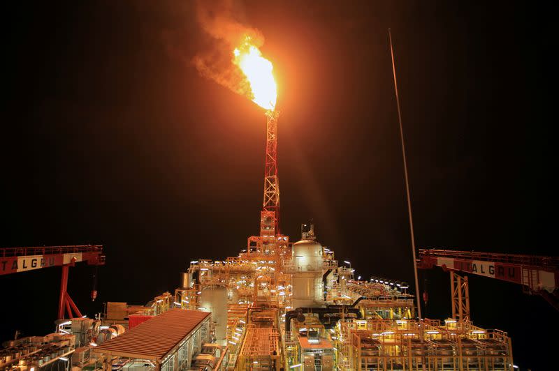 FILE PHOTO: Kaombo Norte floating oil platform is seen at night off the coast of Angola