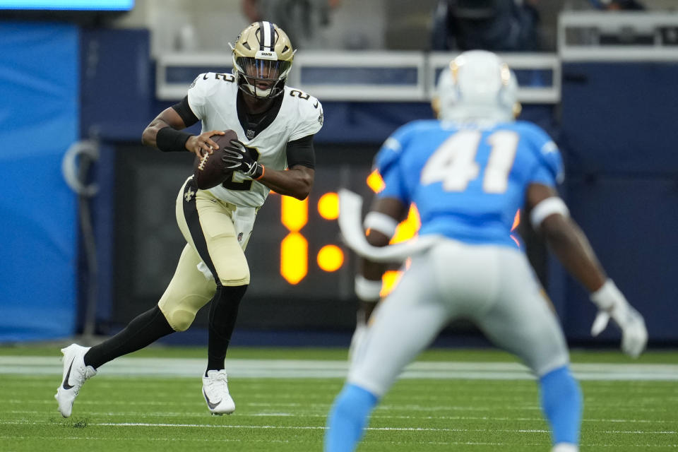 New Orleans Saints quarterback Jameis Winston (2) scrambles in the first half of an NFL football game against the Los Angeles Chargers in Inglewood, Calif., Sunday, Aug. 20, 2023. (AP Photo/Marcio Jose Sanchez)