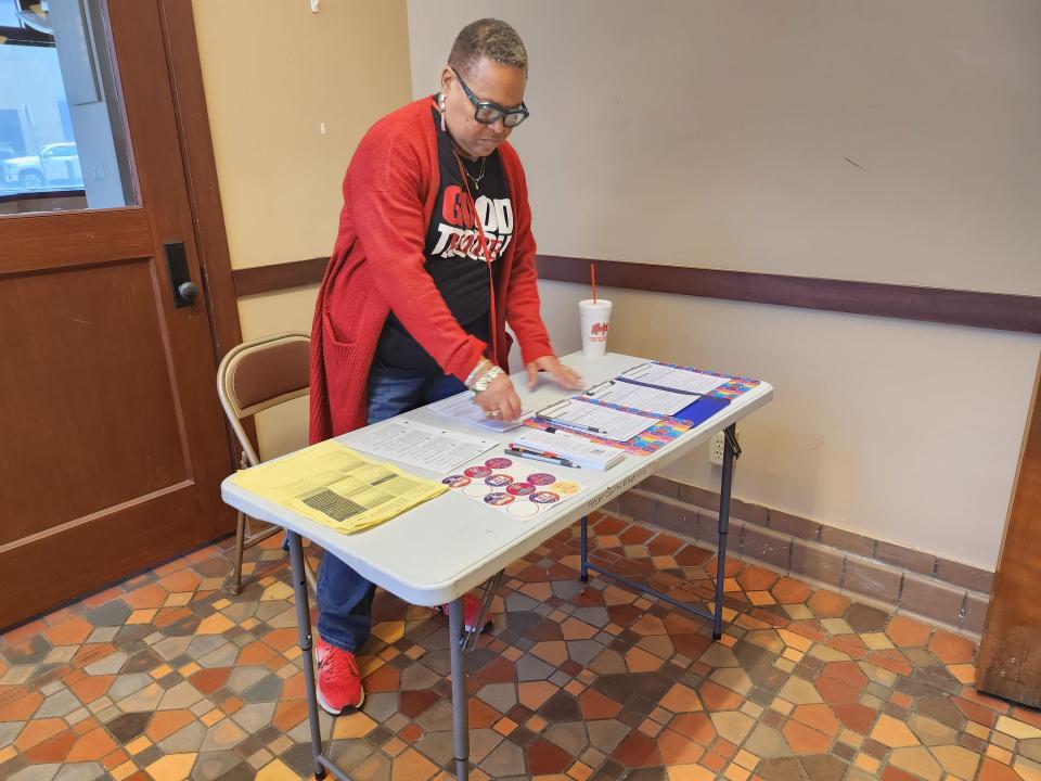 Delores Thompson, volunteer deputy registrar with the  Amarillo League of Women Voters, helps individuals register to vote before registration closes Thursday afternoon at the Potter County Elections Office.