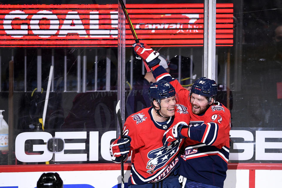 Washington Capitals right wing Daniel Sprong (10) celebrates his goal with center Evgeny Kuznetsov (92) during the second period of an NHL hockey game against the New Jersey Devils, Tuesday, March 9, 2021, in Washington. (AP Photo/Nick Wass)