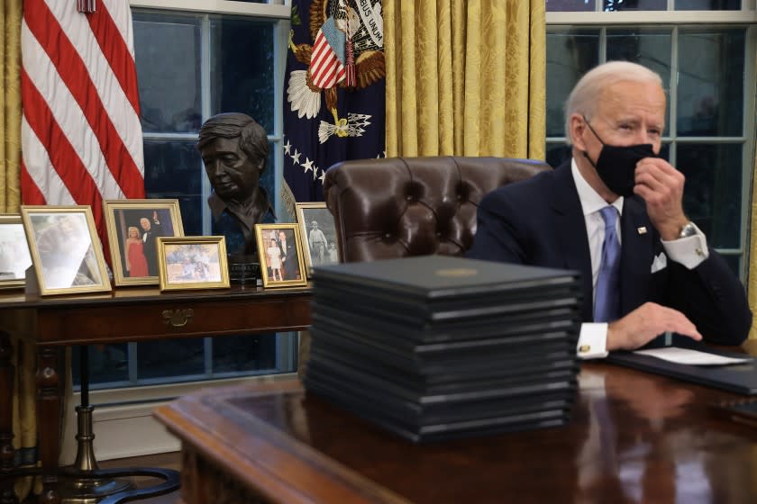 A sculpted bust of Cesar Chavez is seen with U.S. President Joe Biden