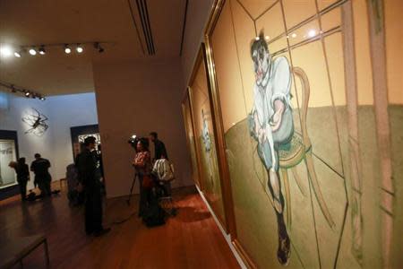 Artist Francis Bacon's "Three Studies of Lucian Freud" is seen during a media preview at Christie's Auction House in New York, October 31, 2013. REUTERS/Shannon Stapleton
