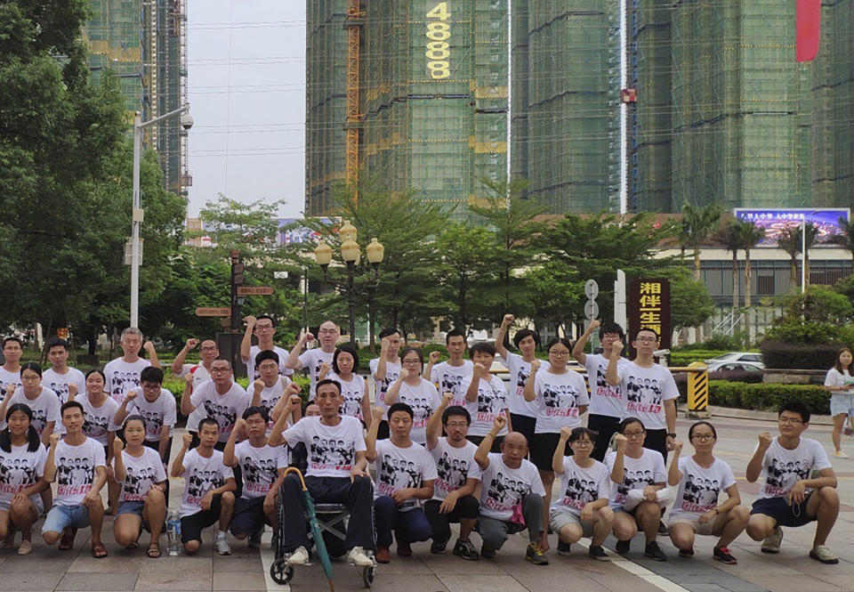 In this photo provided by the Jasic Workers Support Group and taken Aug 2018, members of the Jasic Workers Support Group pose for a group photo after a campaign promoting worker's rights in Dezhou city in Guangdong province. Students and alumni of several Chinese universities are sounding the alarm over the apparent detention of more than a dozen young labor activists including Zhang Shengye, a recent graduate of Peking University, seen at the right standing row, who have been missing since the weekend. (Jasic Workers Support Group via AP)