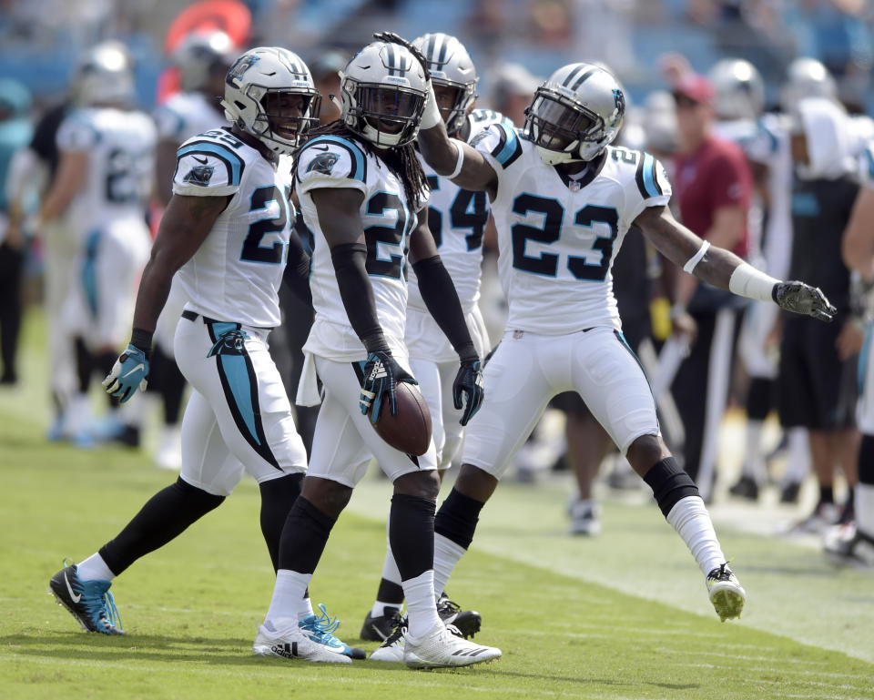 Carolina Panthers' Donte Jackson, center, celebrates with teammates after his interception against the Cincinnati Bengals during the first half of an NFL football game in Charlotte, N.C., Sunday, Sept. 23, 2018. (AP Photo/Mike McCarn)