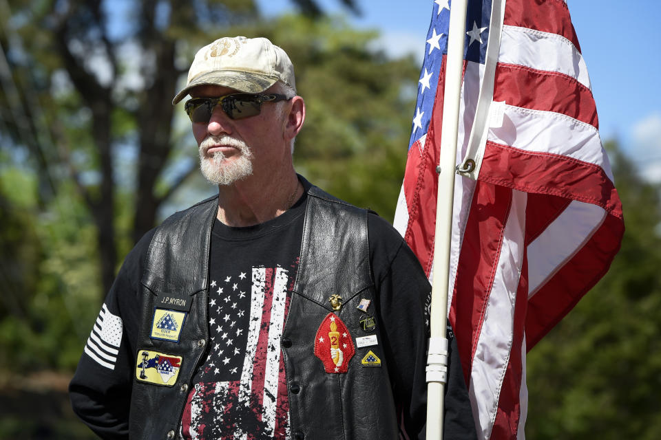 Jeff Myron, a United States military veteran, pays his respects as a Patriot Guard at the memorial service for Riley Howell in Lake Junaluska, N.C., Sunday, May 5, 2019. Family, hundreds of friends and a military honor guard on Sunday remembered Howell, a North Carolina college student credited with saving classmates by rushing a gunman firing inside their lecture hall. (AP Photo/Kathy Kmonicek)