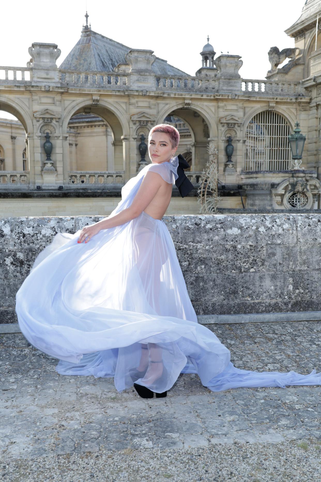 Florence Pugh wore a sheer flowy gown to the Valentino Haute Couture Fall/Winter 2023/2024 show on July 05, 2023 in Chantilly, France.