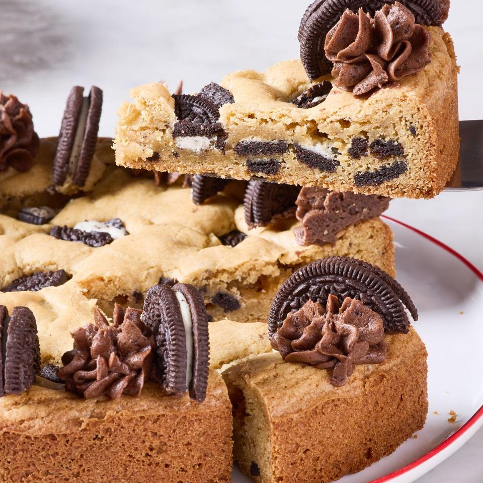 cookie cake with oreos mixed in and on top with chocolate frosting