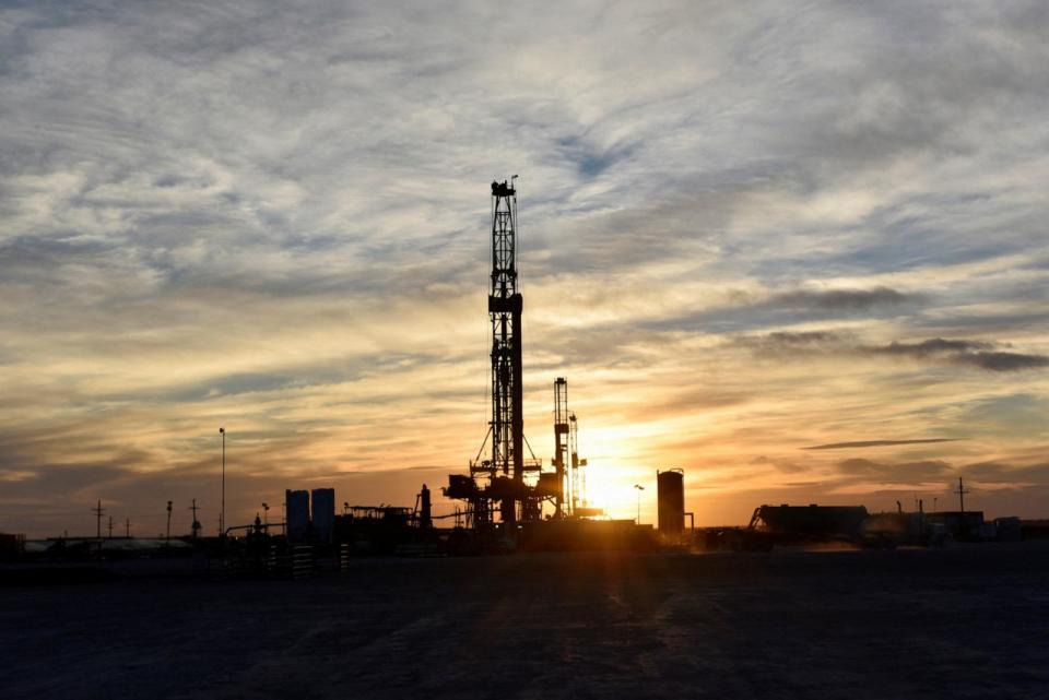 PHOTO: Drilling rigs operate at sunset, Feb 13, 2019, in Midland, Texas. (Nick Oxford/Reuters, FILE)