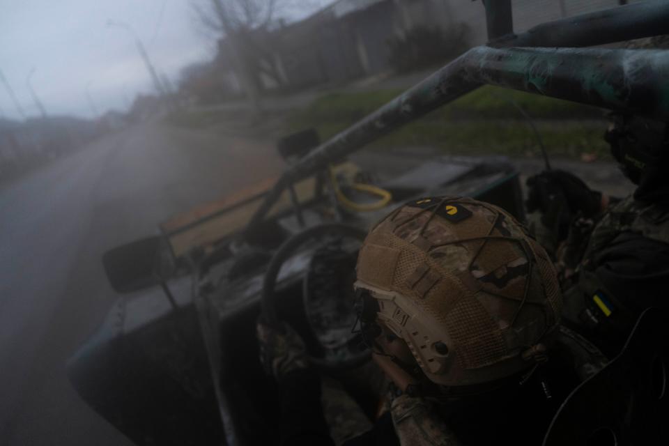 Ukrainian servicemen drive towards the frontline in Kherson, southern Ukraine on 23 November (Copyright 2022 The Associated Press. All rights reserved.)