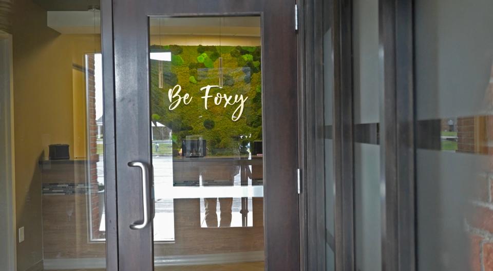 The words "Be Foxy" is emblazoned on Dr. Katharine Roxanne Grawe's former practice called Roxy Plastic Surgery in Powell. Grawe became known to her thousands of social media followers as "Dr. Roxy." The office now appears to be permanently closed, but the artwork remains visible from the entryway.
