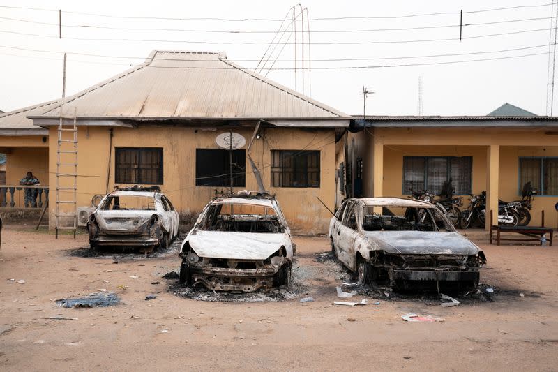 Burnt vehicles are seen outside the Nigeria police force Imo state command headquaters after gunmen attacked and set properties ablaze in Imo State